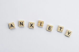 square tiles spelling the word anxiety